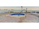Relaxing community hot tub with brick pavers and waterfront views at 6269 Palma Del Mar S Blvd # 111, St Petersburg, FL 33715