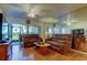 Cozy living room with hardwood floors, comfortable sofas, a mirrored wall, and views of the outdoors at 6269 Palma Del Mar S Blvd # 111, St Petersburg, FL 33715