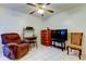 Relaxing living room with tile floors, a ceiling fan, recliner, and media center at 6269 Palma Del Mar S Blvd # 111, St Petersburg, FL 33715