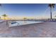 Inviting community pool with brick pavers, palm trees and skyline views at 6269 Palma Del Mar S Blvd # 111, St Petersburg, FL 33715