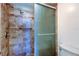Modern tiled shower with glass doors and convenient grab bar at 6269 Palma Del Mar S Blvd # 111, St Petersburg, FL 33715