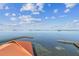 Stunning aerial view of the waterfront featuring a beautiful sky and private dock access at 634 Edgewater Dr # 744, Dunedin, FL 34698
