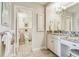 Clean bathroom with a granite countertop vanity and neutral tilework, offering a serene and functional space at 634 Edgewater Dr # 744, Dunedin, FL 34698