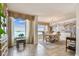 Elegant dining room with a chandelier, scenic views, and custom mural at 634 Edgewater Dr # 744, Dunedin, FL 34698