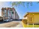 Exterior facade of condos with covered parking and clear signage, perfect for condo living at 634 Edgewater Dr # 744, Dunedin, FL 34698