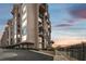 Beautiful condo building with balconies and a stunning waterfront view at sunset at 634 Edgewater Dr # 744, Dunedin, FL 34698