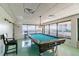 Recreational game room featuring a pool table and panoramic views, perfect for leisure and entertainment at 634 Edgewater Dr # 744, Dunedin, FL 34698
