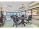 Bright game room with a poker table, billiards, and ocean views at 634 Edgewater Dr # 744, Dunedin, FL 34698