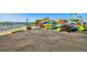 Outdoor storage area filled with colorful kayaks and canoes, perfect for waterfront adventures at 634 Edgewater Dr # 744, Dunedin, FL 34698
