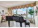 Stunning piano by the window with water view at 634 Edgewater Dr # 744, Dunedin, FL 34698