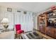 Cozy living room with chessboard, built-in bookcase and white closet doors at 634 Edgewater Dr # 744, Dunedin, FL 34698