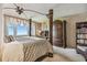 Spacious main bedroom with floor to ceiling windows, a king bed, and elegant furnishings with water view at 634 Edgewater Dr # 744, Dunedin, FL 34698