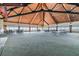 Large meeting room featuring a high wood ceiling, neutral carpeting, and expansive windows with water views at 634 Edgewater Dr # 744, Dunedin, FL 34698