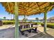 Community outdoor lounge area with shaded seating, perfect for relaxing and enjoying the waterfront views at 634 Edgewater Dr # 744, Dunedin, FL 34698
