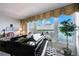 Elegant room with a piano and scenic water view, offering a tranquil and inspiring atmosphere at 634 Edgewater Dr # 744, Dunedin, FL 34698