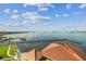 Expansive water view featuring a scenic pier stretching into the horizon under a blue, partly cloudy sky at 634 Edgewater Dr # 744, Dunedin, FL 34698