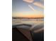 Breathtaking waterfront view with pier under colorful dawn sky at 634 Edgewater Dr # 744, Dunedin, FL 34698