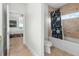 Bathroom featuring tile floors and a shower-tub combination with a framed shower curtain at 829 Blue Heron Blvd, Ruskin, FL 33570