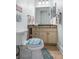 Nicely decorated half bath with coastal decor at 829 Blue Heron Blvd, Ruskin, FL 33570