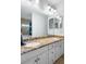 Bathroom featuring double sinks with granite counters and a shower-tub combination at 829 Blue Heron Blvd, Ruskin, FL 33570
