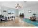 Large bedroom offers lots of natural light, tiled flooring, and ceiling fan at 829 Blue Heron Blvd, Ruskin, FL 33570