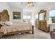 Comfortable bedroom with neutral decor and two windows for an abundance of natural light at 829 Blue Heron Blvd, Ruskin, FL 33570