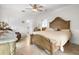 Bright bedroom with ceiling fan, tile floors, and luxury decor at 829 Blue Heron Blvd, Ruskin, FL 33570