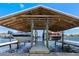 Waterfront boat dock with electric boat lifts and pier walkway at 829 Blue Heron Blvd, Ruskin, FL 33570