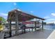 Waterfront boat dock with electric boat lifts and deck at 829 Blue Heron Blvd, Ruskin, FL 33570