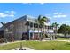 Beautiful two-story waterfront home with screened in porch and lush landscaping at 829 Blue Heron Blvd, Ruskin, FL 33570