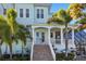 Inviting entryway with beautiful front door, grand columns, and well-manicured landscaping at 829 Blue Heron Blvd, Ruskin, FL 33570