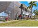 This home features a large screened-in lanai, which adds extra living space, and landscaped grounds at 829 Blue Heron Blvd, Ruskin, FL 33570