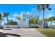 Charming two-story coastal home featuring lush landscaping, an attached two-car garage, and a spacious driveway at 829 Blue Heron Blvd, Ruskin, FL 33570