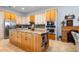 Spacious kitchen with stainless steel appliances and a large center island at 829 Blue Heron Blvd, Ruskin, FL 33570