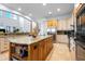 Kitchen with stainless appliances, granite countertops, access to a staircase at 829 Blue Heron Blvd, Ruskin, FL 33570
