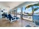 Screened lanai with outdoor seating overlooking the water at 829 Blue Heron Blvd, Ruskin, FL 33570