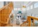 Bright living room featuring a wall of windows with backyard views, tile floors, and a staircase to the second level at 829 Blue Heron Blvd, Ruskin, FL 33570