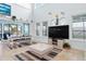 Spacious living room featuring high ceilings, an adjacent dining area, and bright sunlight at 829 Blue Heron Blvd, Ruskin, FL 33570