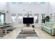 Open-concept living space offering abundant natural light, high ceilings and water views at 829 Blue Heron Blvd, Ruskin, FL 33570