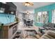 Open-concept living room with comfortable seating, a television, and a dining area at 829 Blue Heron Blvd, Ruskin, FL 33570