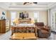 Spacious main bedroom with tray ceilings and rustic furniture at 829 Blue Heron Blvd, Ruskin, FL 33570