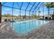 Enclosed pool with brick edging, great water and canal views at 829 Blue Heron Blvd, Ruskin, FL 33570