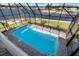 Screened pool overlooking a canal waterfront at 829 Blue Heron Blvd, Ruskin, FL 33570