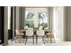 Bright dining room with natural wood table, modern chairs, large windows, and stylish decor at 9640 Runaway Breeze Dr, Land O Lakes, FL 34637