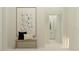 Bright hallway with bench, decorative pillows, and a framed art print at 9640 Runaway Breeze Dr, Land O Lakes, FL 34637