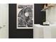 Functional laundry room with modern art, white cabinets, and laundry machines at 9640 Runaway Breeze Dr, Land O Lakes, FL 34637