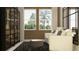 Cozy living room featuring comfortable seating, a stylish rug, and a bookshelf with curated decor at 9640 Runaway Breeze Dr, Land O Lakes, FL 34637