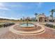 A picturesque fountain graces the entrance to Club Connerton, inviting relaxation and community gathering at 9683 Ashworth Pl, Land O Lakes, FL 34637