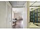 Hallway leads to a bathroom and formal dining room at 101 Cambridge Trl # 199, Sun City Center, FL 33573