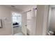 Modern bathroom featuring a shower over tub with subway tile surround and a bedroom view at 10115 Paradise Fish Dr, Riverview, FL 33578
